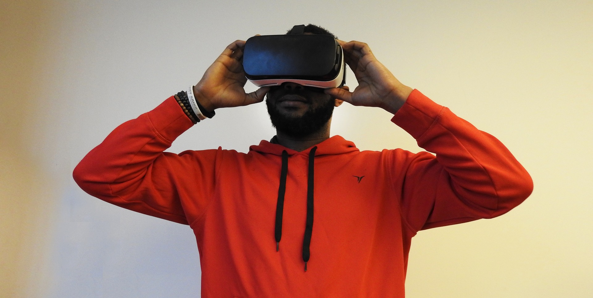 man holding a headset over his face